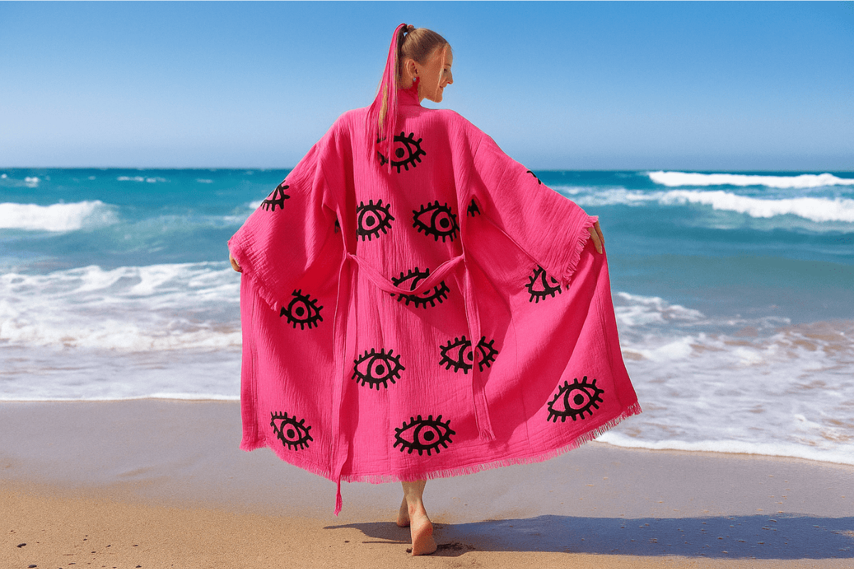 A breezy pink caftan flowing in sea breeze