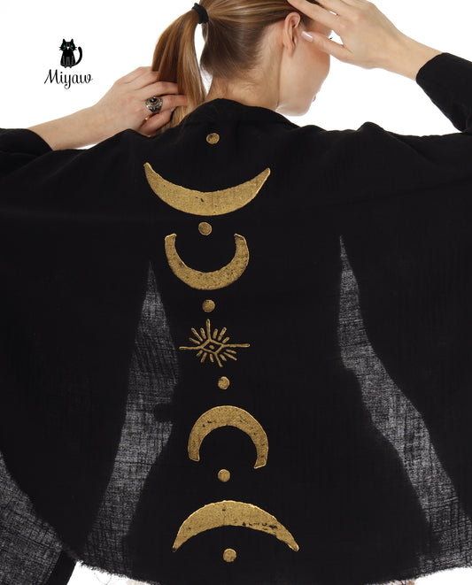 A woman wears a Boho Cotton Beach Celestial Cover Ups in Swimwear