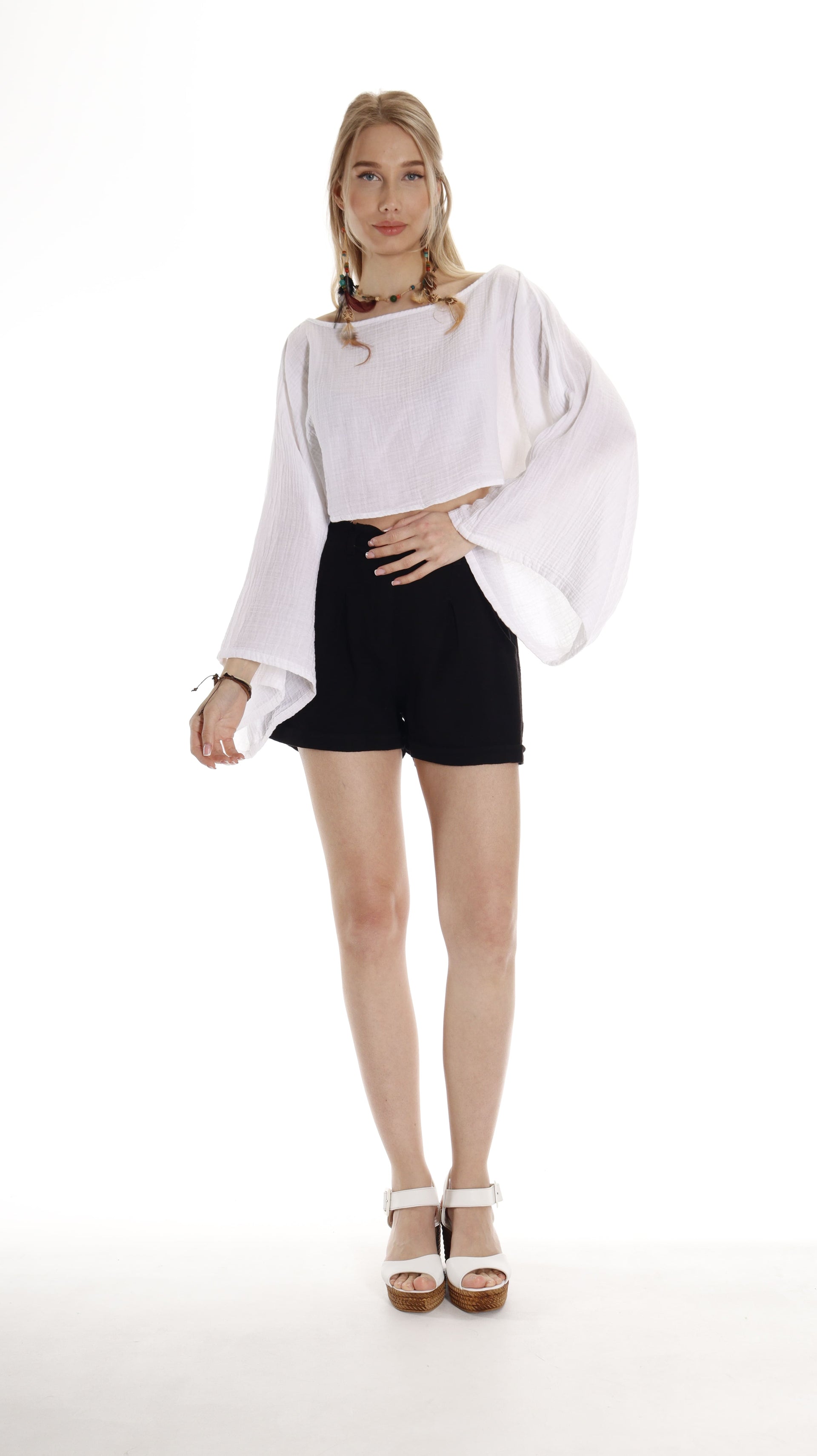 White boho top with long sleeves and boat neck