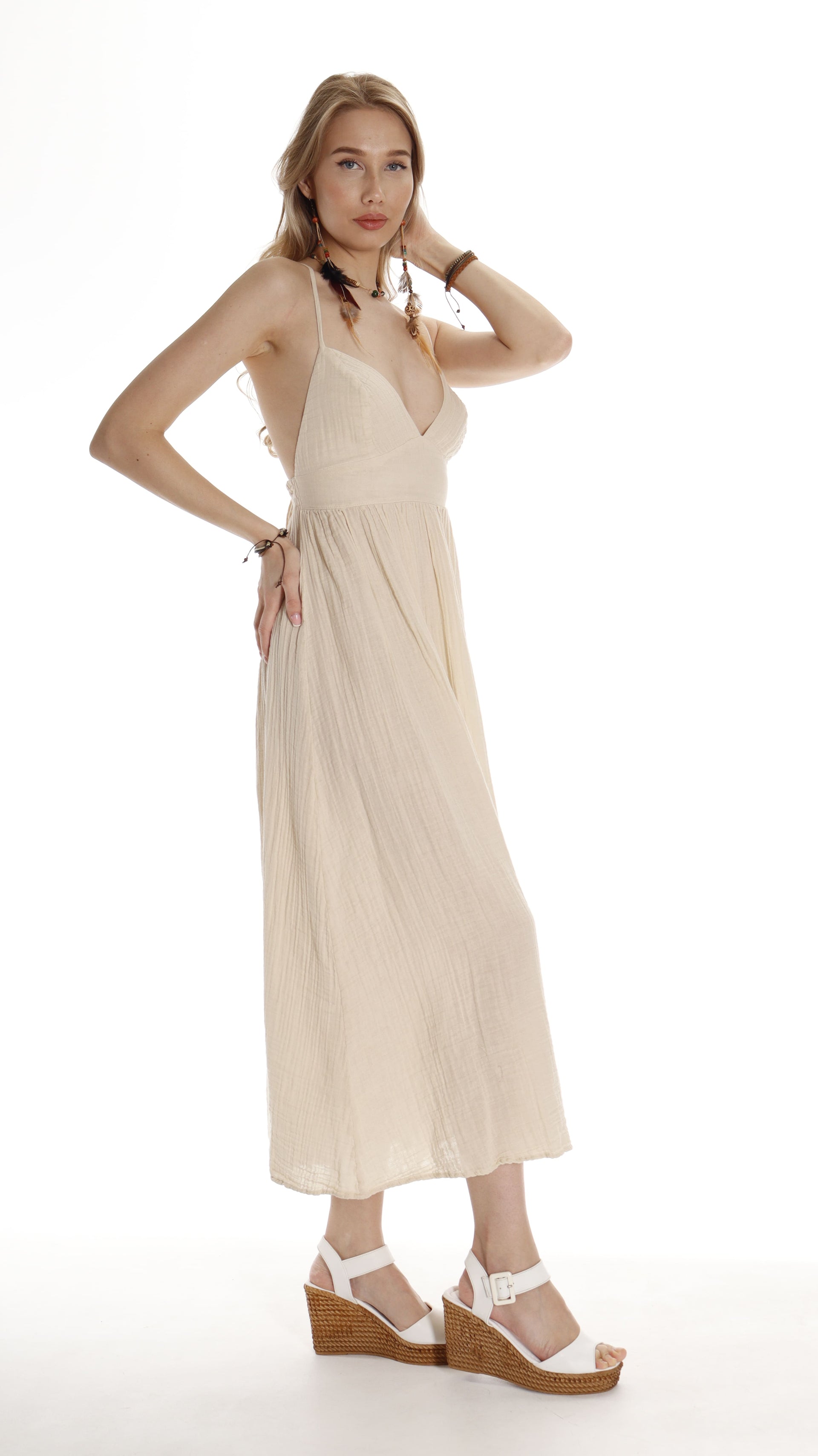 Woman dressed in boho blue maxi dress with soft, flowing batwing sleeves