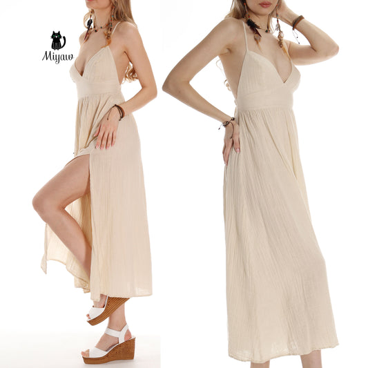 Woman in beige boho cotton maxi dress with open back