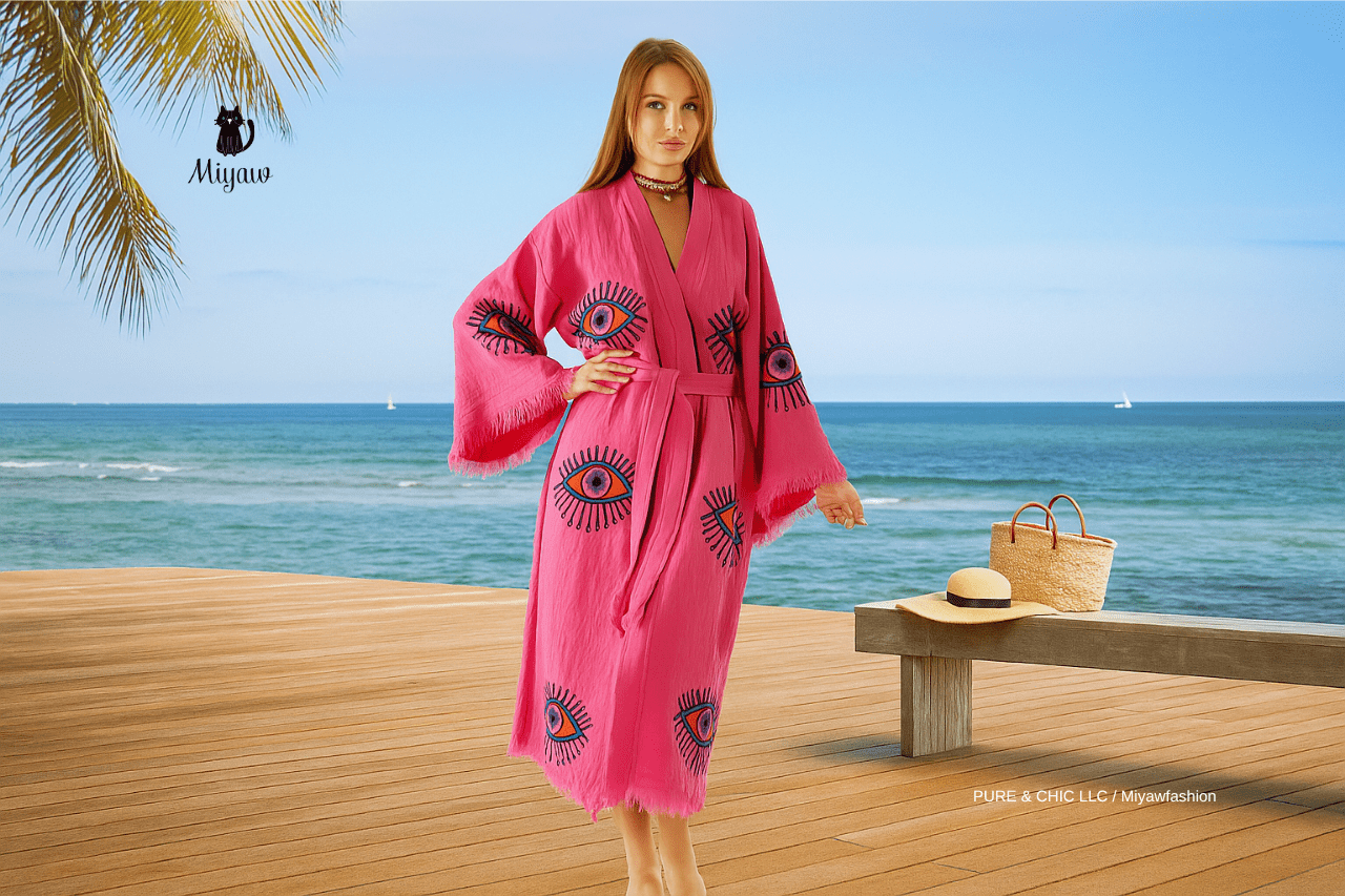 Sustainable organic cotton resort wear woman by sunny coastal boardwalk