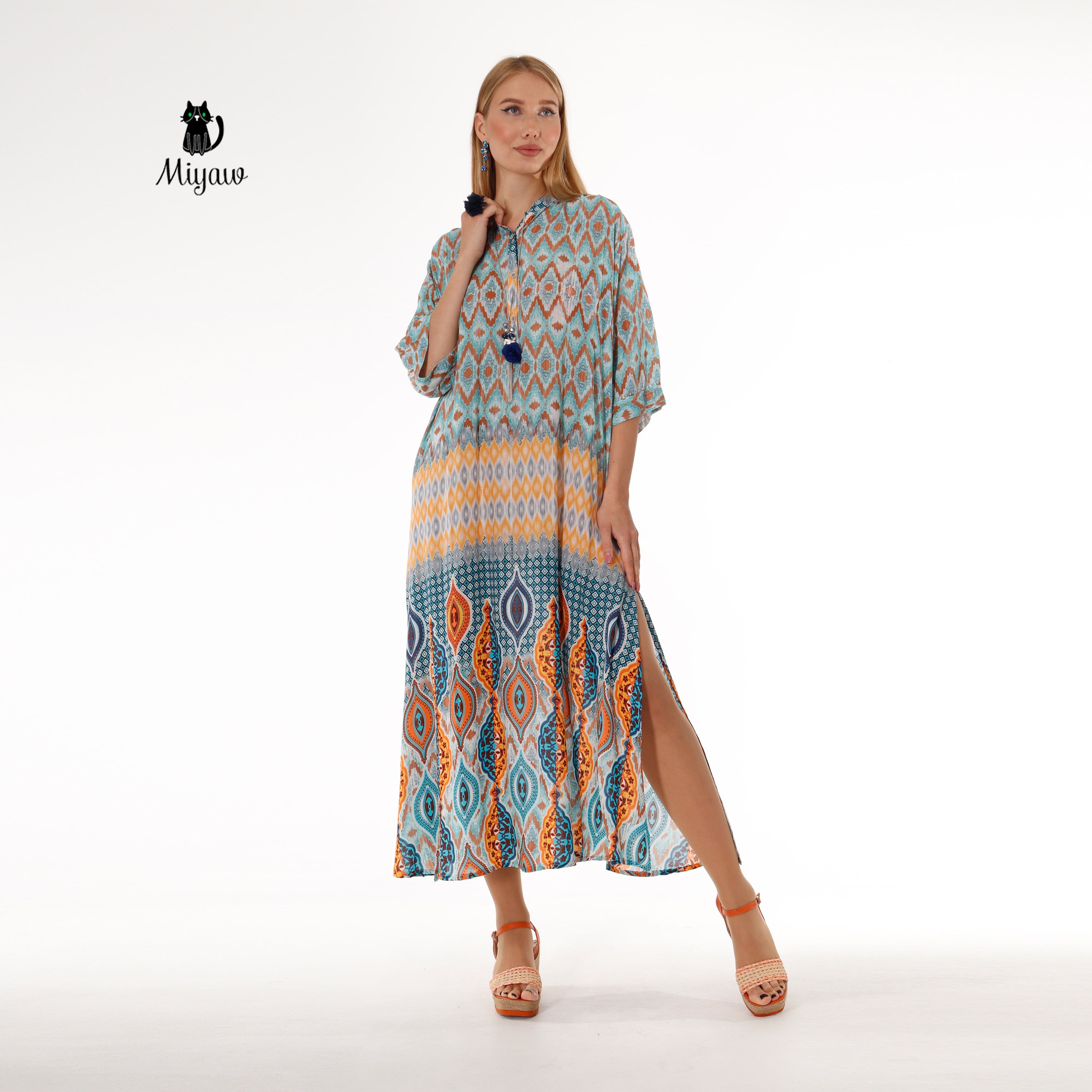 Model in boho-inspired blue maxi dress featuring flowy batwing sleeves