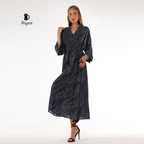 Woman showcasing black long sleeve dress maxi style with bohemian elegance
