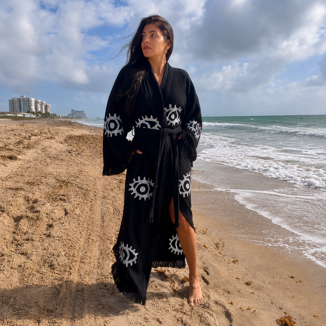 Front view of a handcrafted black 100% cotton Evil Eye kimono robe for women by MIYAW Fashion.