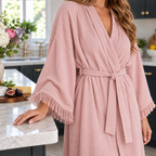 Dusty rose robe with a textured cotton fabric, worn in a kitchen setting.
